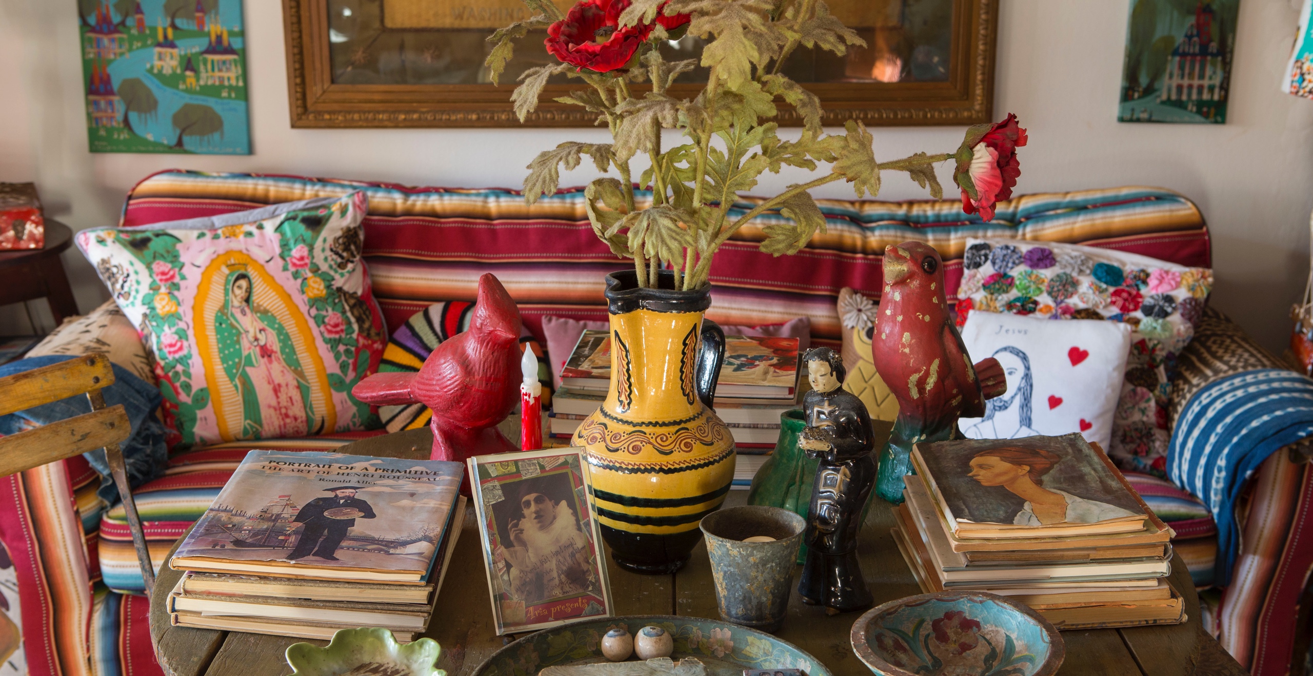 In the author’s New York City apartment, an eclectic tabletop exhibit of beloved flea market finds, souvenirs of travel, and gifts from friends