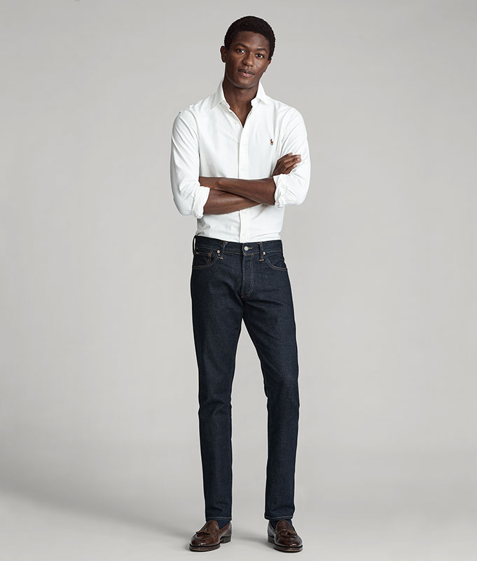Man in white button-down & dark-wash slim Polo jeans